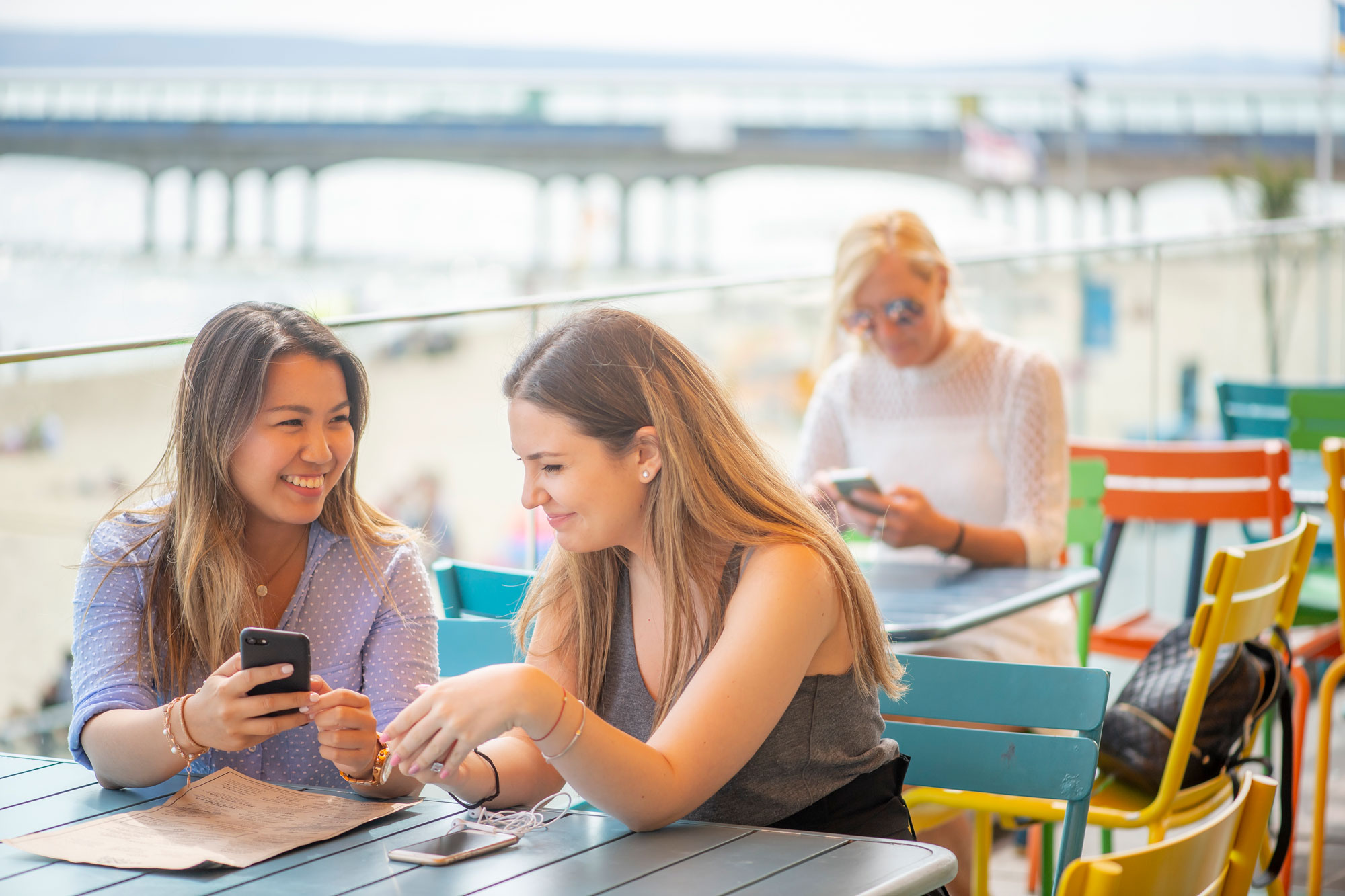 Female students socialising at a cafe on Boscombe Beach
