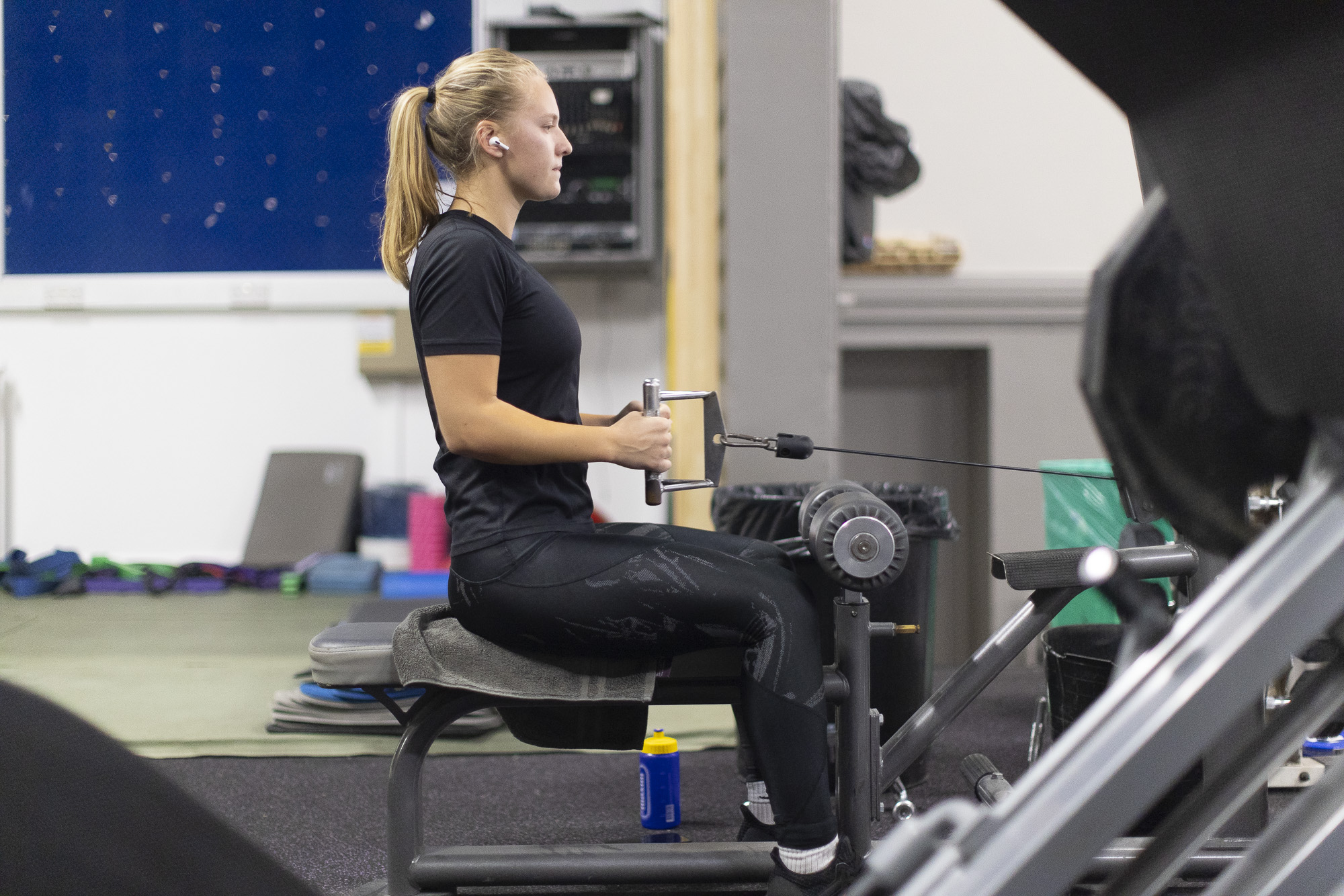 student using a machine at the ASU gym