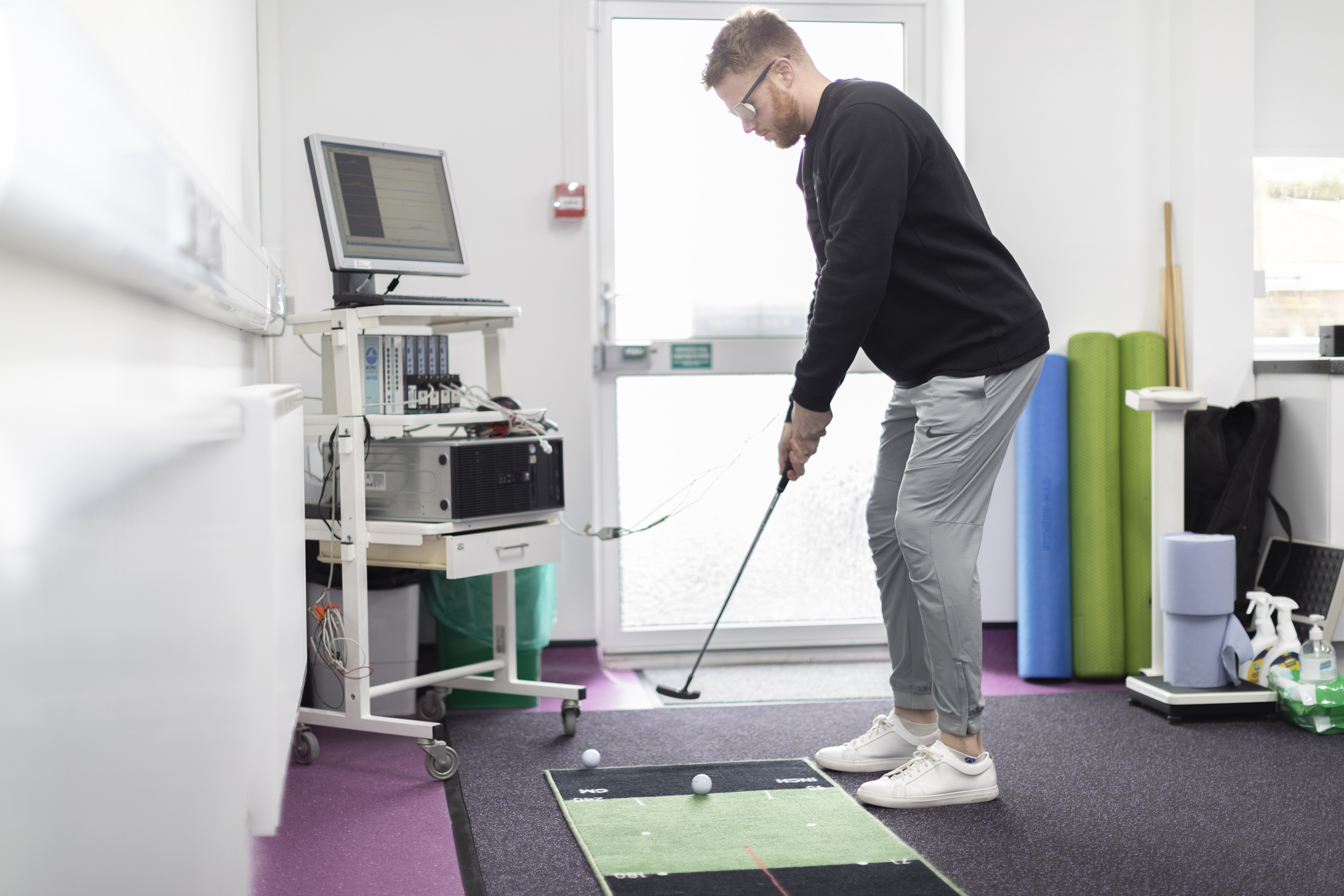 MSc Sport and Exercise Psychology student working on golf technique