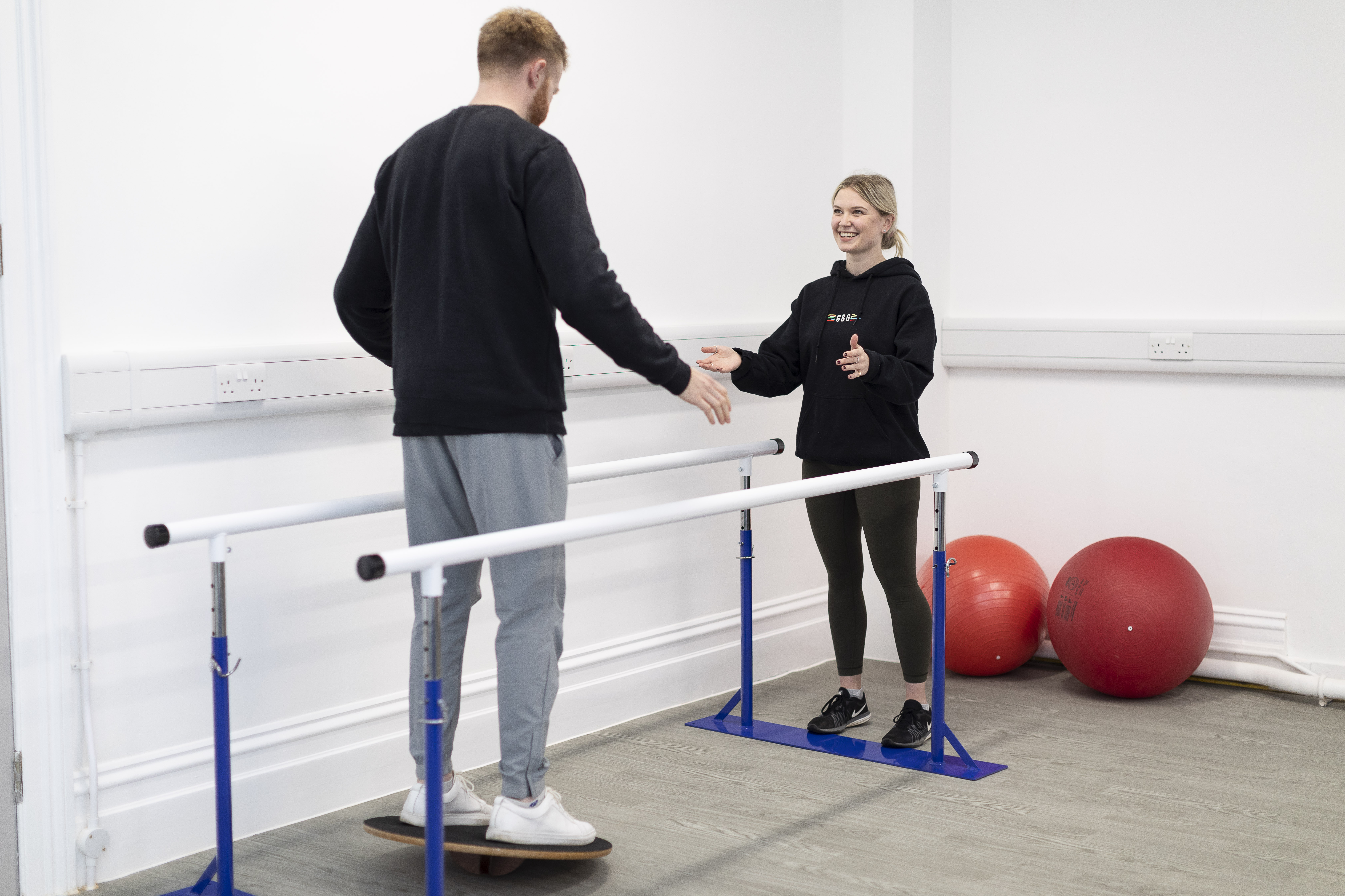 MSc Sport and Exercise Rehabilitation Class - students on walking support bars.